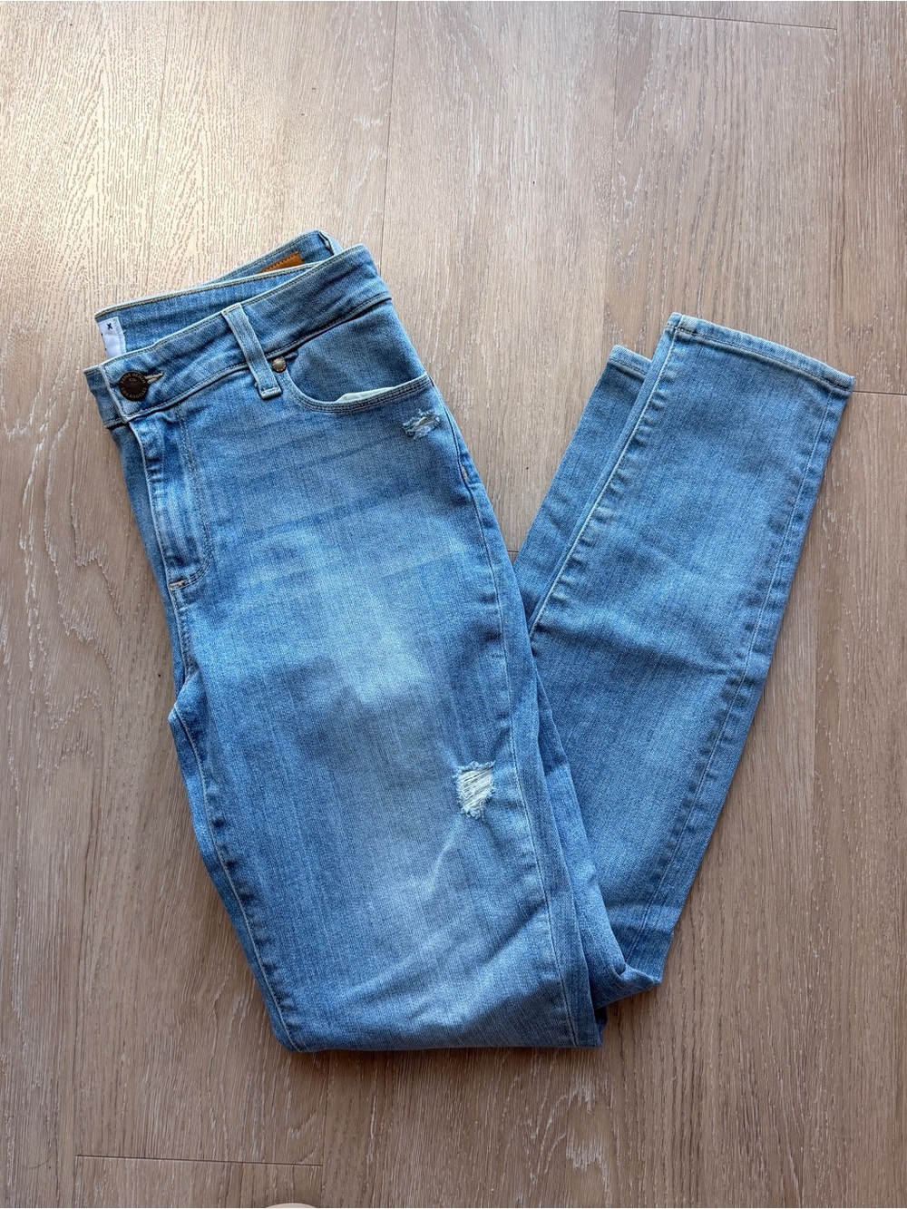 Paige light wash skinny jeans